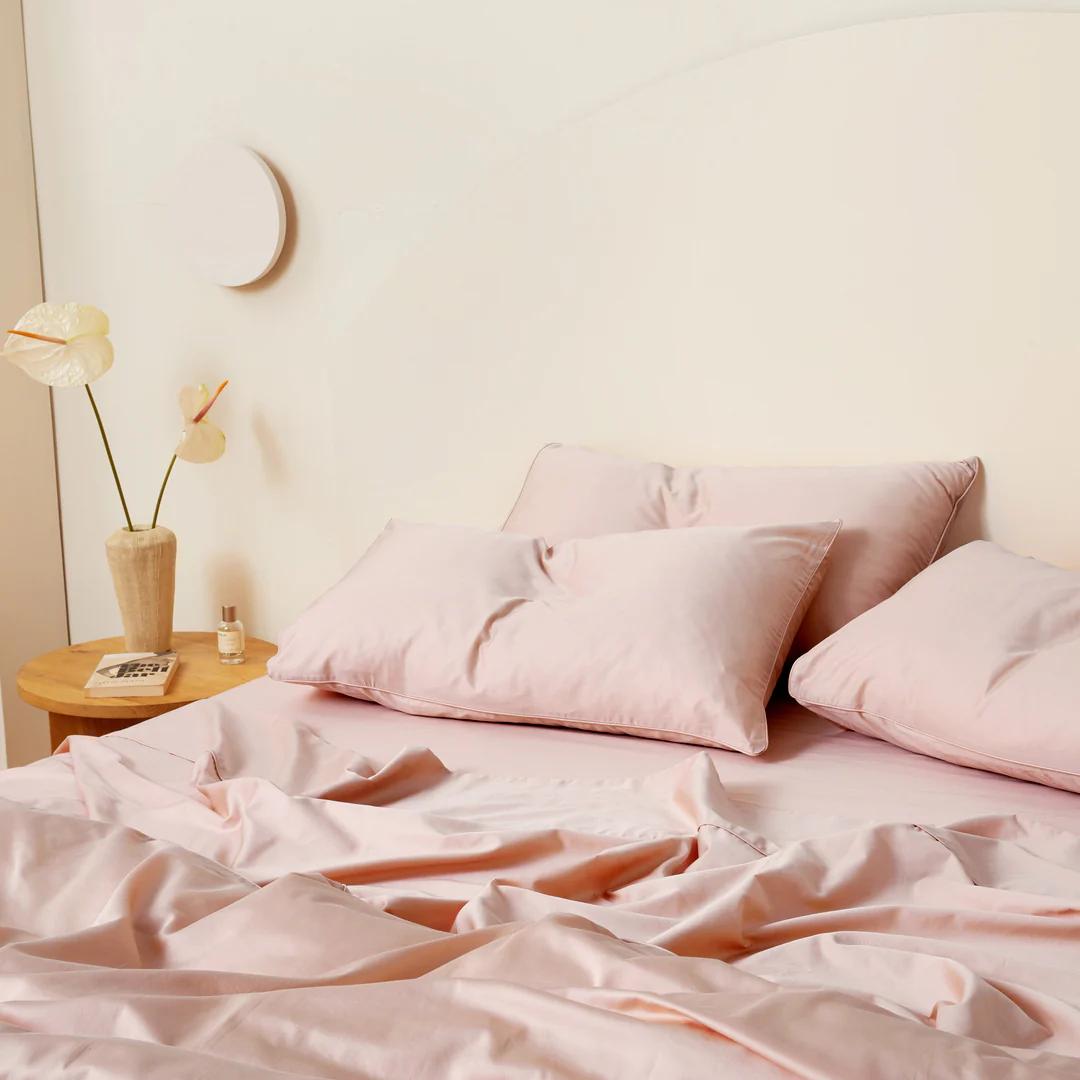 Blush pink bedding made up in a bright room, Blush Luxe Collection