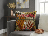 Tropical botanical printed cotton cushion cover featuring colorful leaves and floral motifs on a sofa