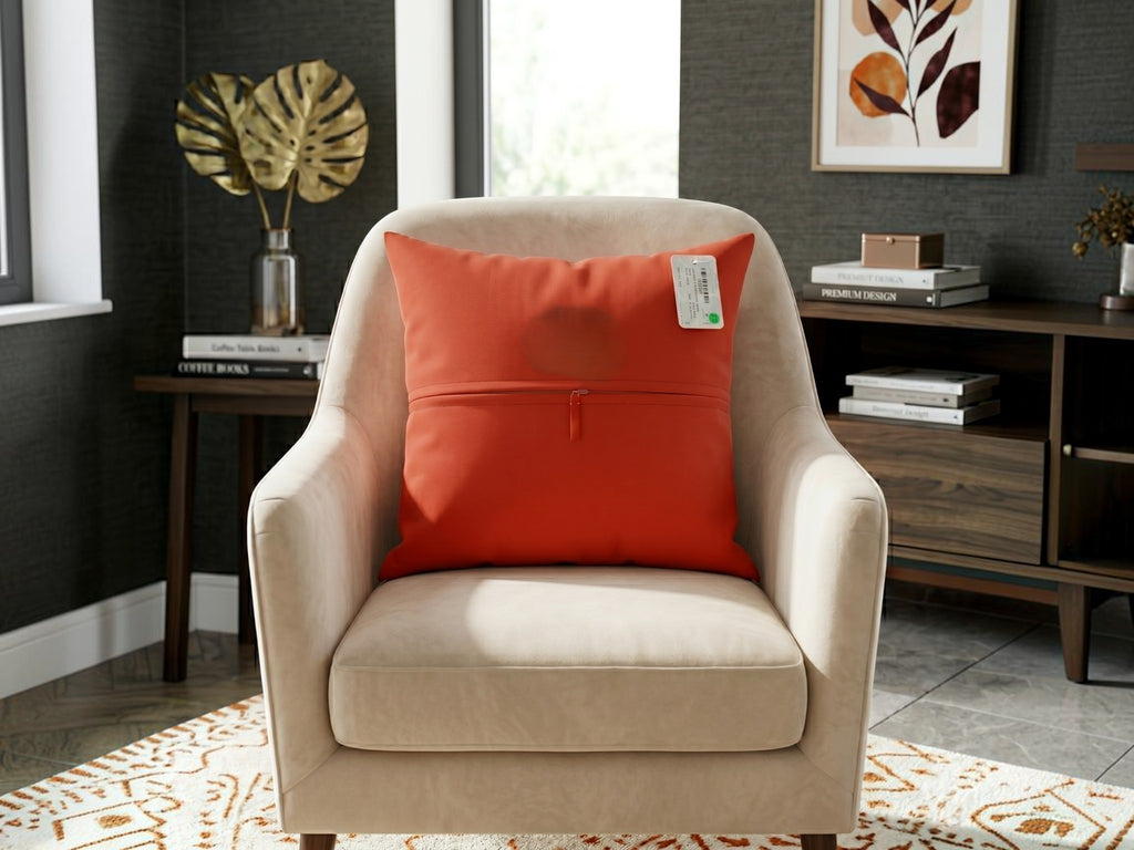Back view of orange polysilk cushion cover with solid color finish and concealed zipper closure
