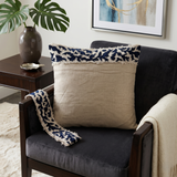 Beige cushion cover with detachable black patterned accent strip