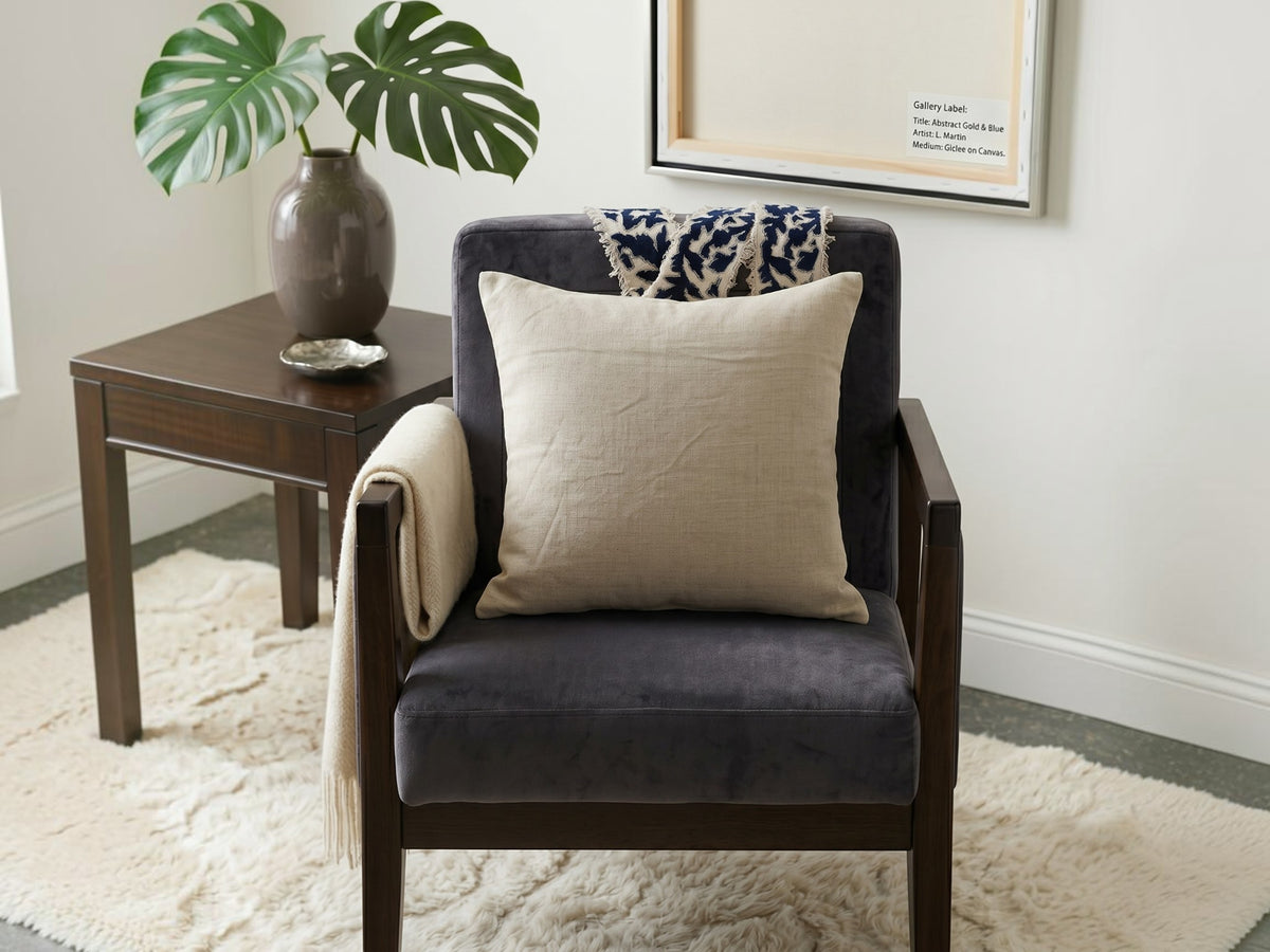 Beige cushion cover with detachable black patterned accent strip