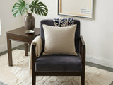 Beige cushion cover with detachable black patterned accent strip