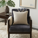 Beige cushion cover with detachable black patterned accent strip