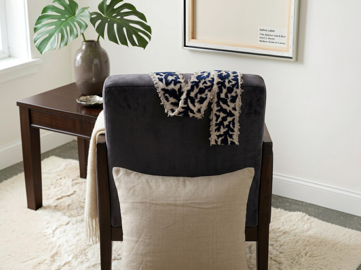 Beige cushion cover with detachable black patterned accent strip