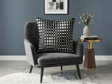 Black velvet cushion cover with geometric woven circular pattern in contrasting ivory tones