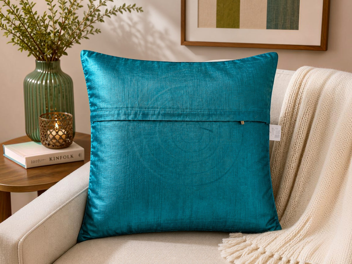 Blue patch work polysilk cushion cover with circular applique design