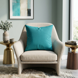 Blue plain polysilk cushion cover on a beige accent chair with a smooth solid color finish