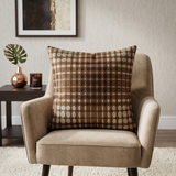 Brown geometric printed cushion cover featuring an abstract circular pattern in brown and beige tones