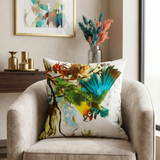 Cotton cushion cover featuring a colorful tropical parrot print with botanical foliage artwork on a light background