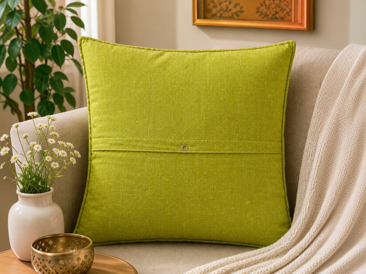 Green cotton cushion cover with floral embroidery and vine design