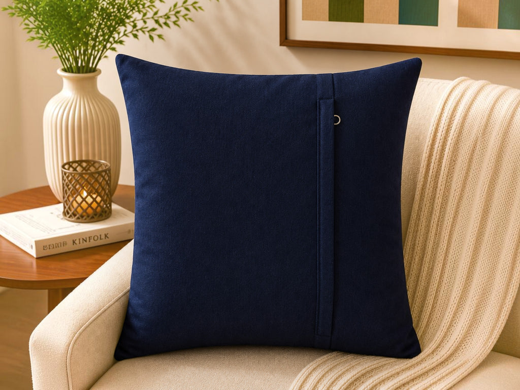 Navy blue velvet cushion cover with geometric dot pattern in beige and taupe tones