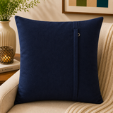 Navy blue velvet cushion cover with geometric dot pattern in beige and taupe tones