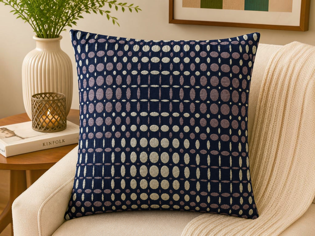 Navy blue velvet cushion cover with geometric dot pattern in beige and taupe tones
