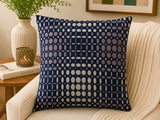 Navy blue velvet cushion cover with geometric dot pattern in beige and taupe tones