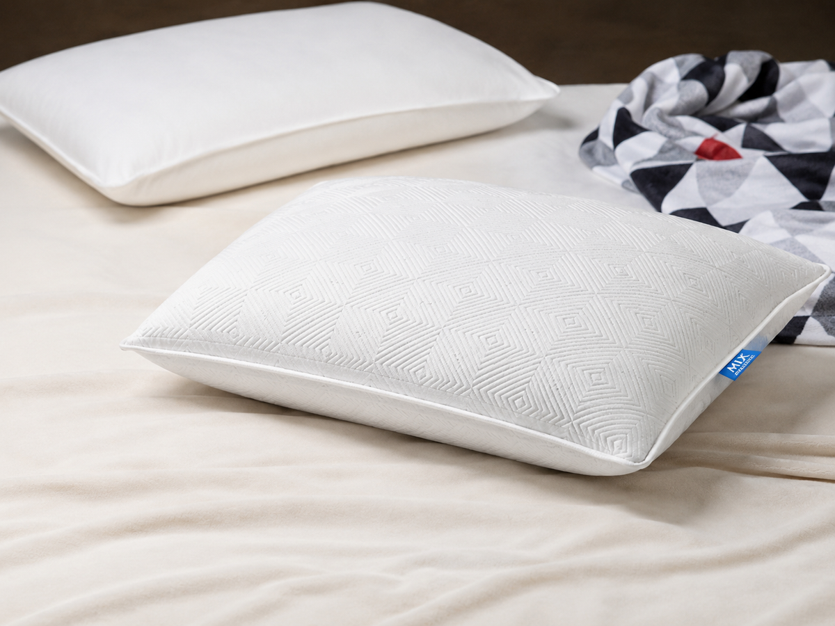 Two white latex pillows on a bed, mmFoam Passion Pillow