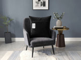 Black velvet cushion cover with geometric woven circular pattern in contrasting ivory tones