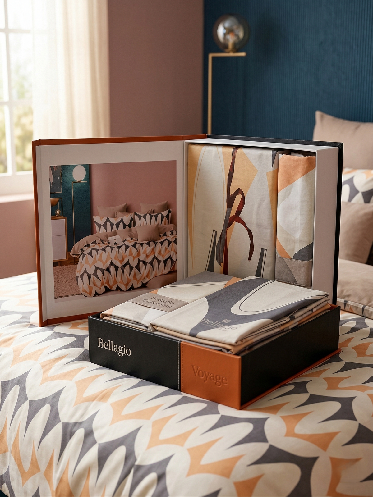 Open Voyage gift box showing the folded bedsheet and the design photo in the lid