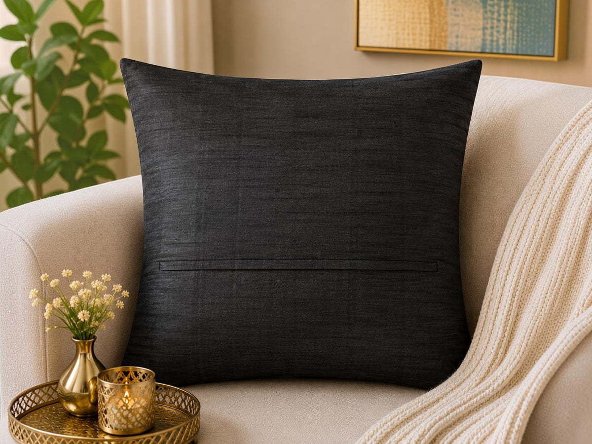 Jagdish Store black decorative throw cushion cover with pleated vertical channels revealing vibrant red accents.