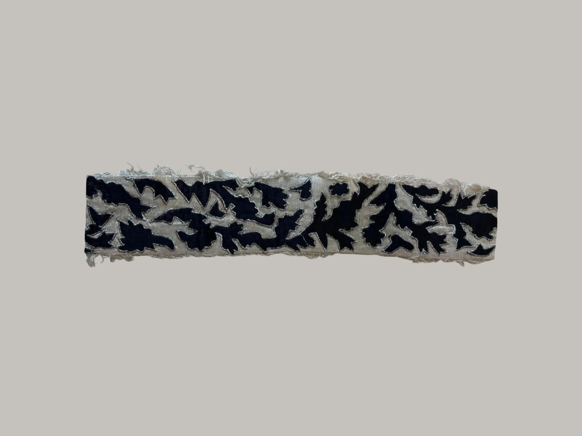 Jagdish Store decorative throw pillow cover featuring a black leaf pattern on a beige linen-blend fabric