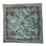 Jagdish Store light blue satin throw pillow cover with copper embroidery, sequins, and turquoise faux gemstones.