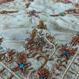 Jagdish Store light blue satin throw pillow cover with copper embroidery, sequins, and turquoise faux gemstones.