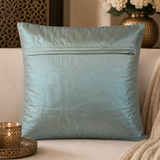 Jagdish Store light blue satin throw pillow cover with copper embroidery, sequins, and turquoise faux gemstones.