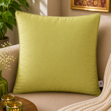 Jagdish Store lime green cushion cover with embroidered orange and gold floral pattern. Textured fabric.