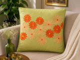Jagdish Store lime green cushion cover with embroidered orange and gold floral pattern. Textured fabric.