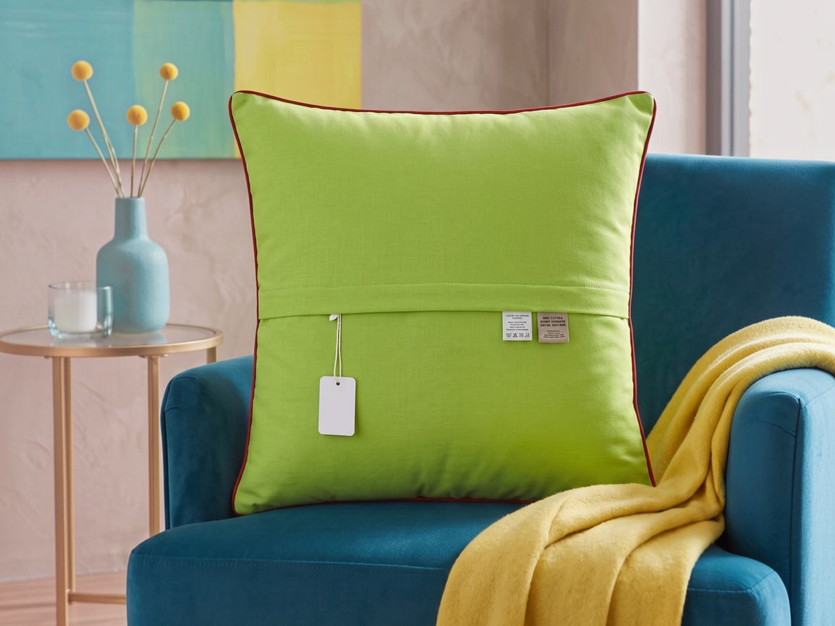 Plain lime green reverse of the embroidered leaf cushion cover
