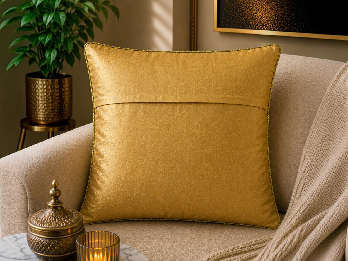 Jagdish Store decorative cushion cover with crimson red fabric, gold lotus embroidery, and gold trim. Features green accents.