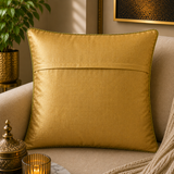 Jagdish Store decorative cushion cover with crimson red fabric, gold lotus embroidery, and gold trim. Features green accents.
