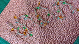 Jagdish Store pink quilted pillow cover with embroidered silver thread, colorful beads, and emerald green border.