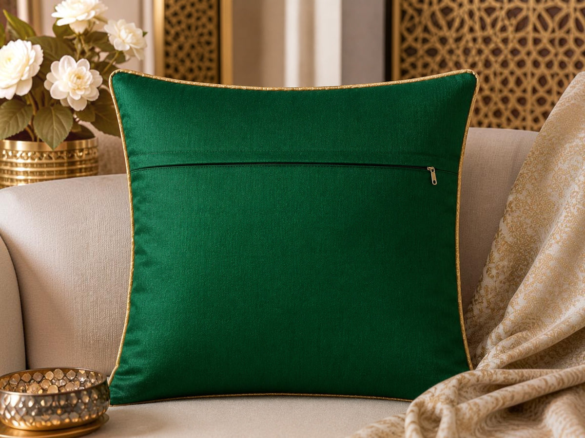 Jagdish Store emerald green throw Cushion cover with intricate shimmering gold floral embroidery and gold piping.