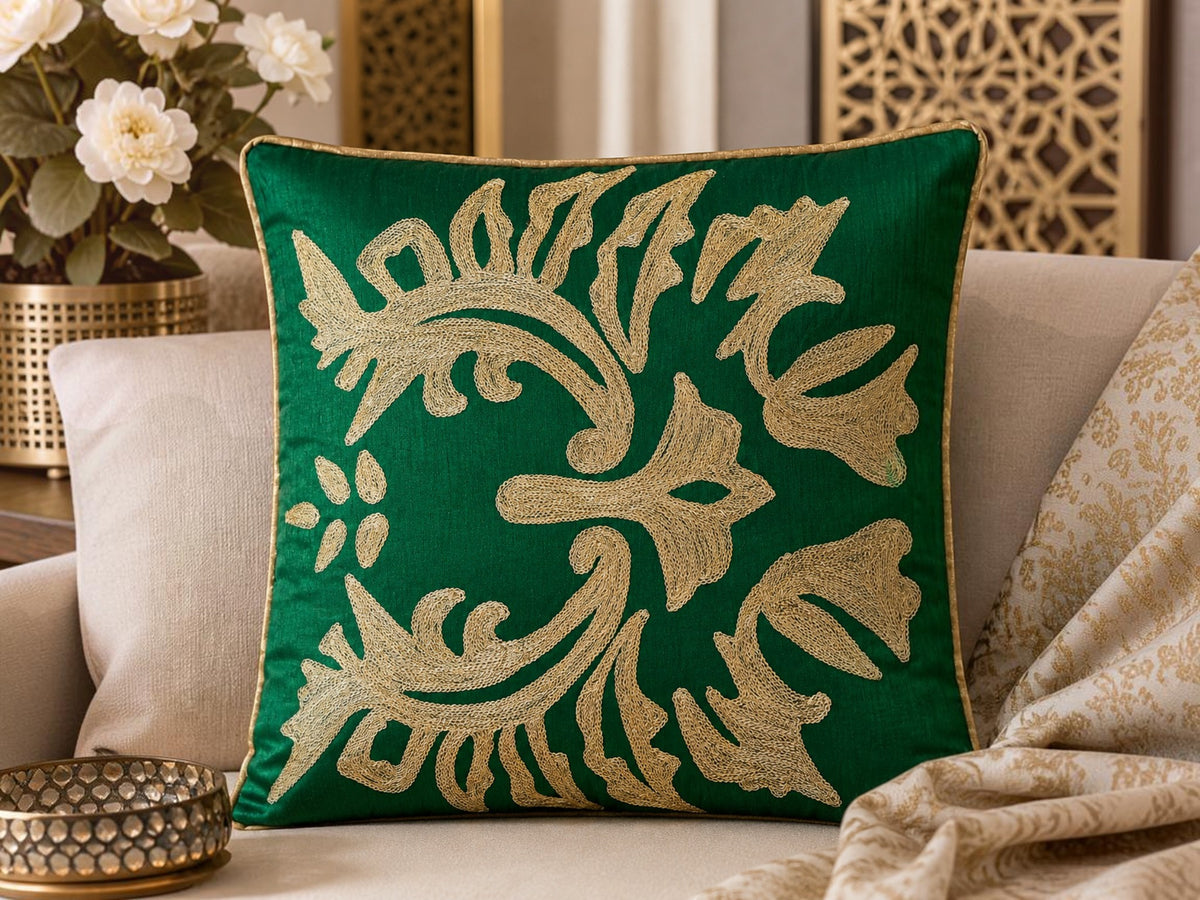 Jagdish Store emerald green throw Cushion cover with intricate shimmering gold floral embroidery and gold piping.