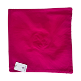 Jagdish Store fuchsia square throw pillow cover with a central rosette pleated design on a white textured background.