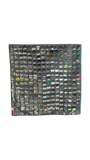 Jagdish Store grey textured square pillow cover with overlapping discs and colorful rings in neon pink, teal, orange, and lime green.