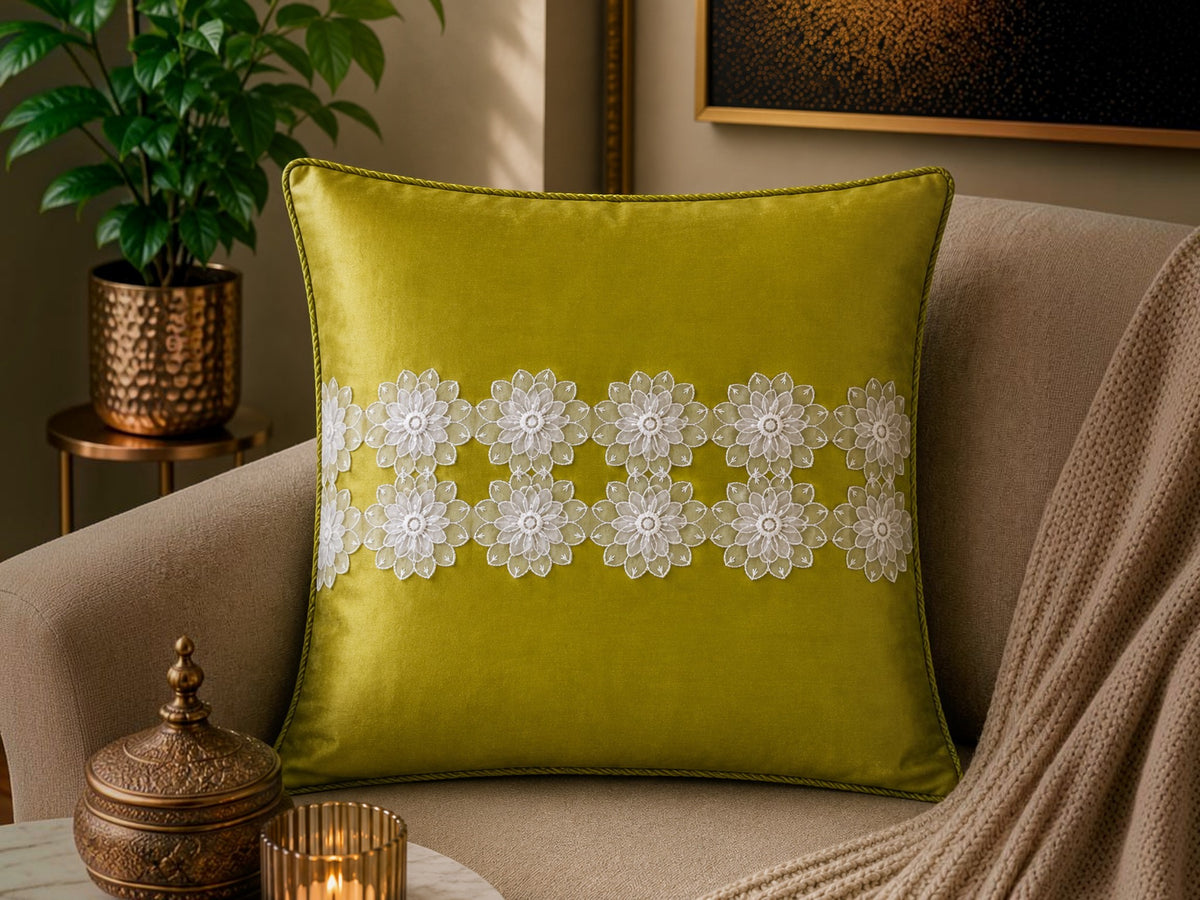 Jagdish Store decorative cushion cover in lime green satin with white floral lace trim. Elegant floral accents.
