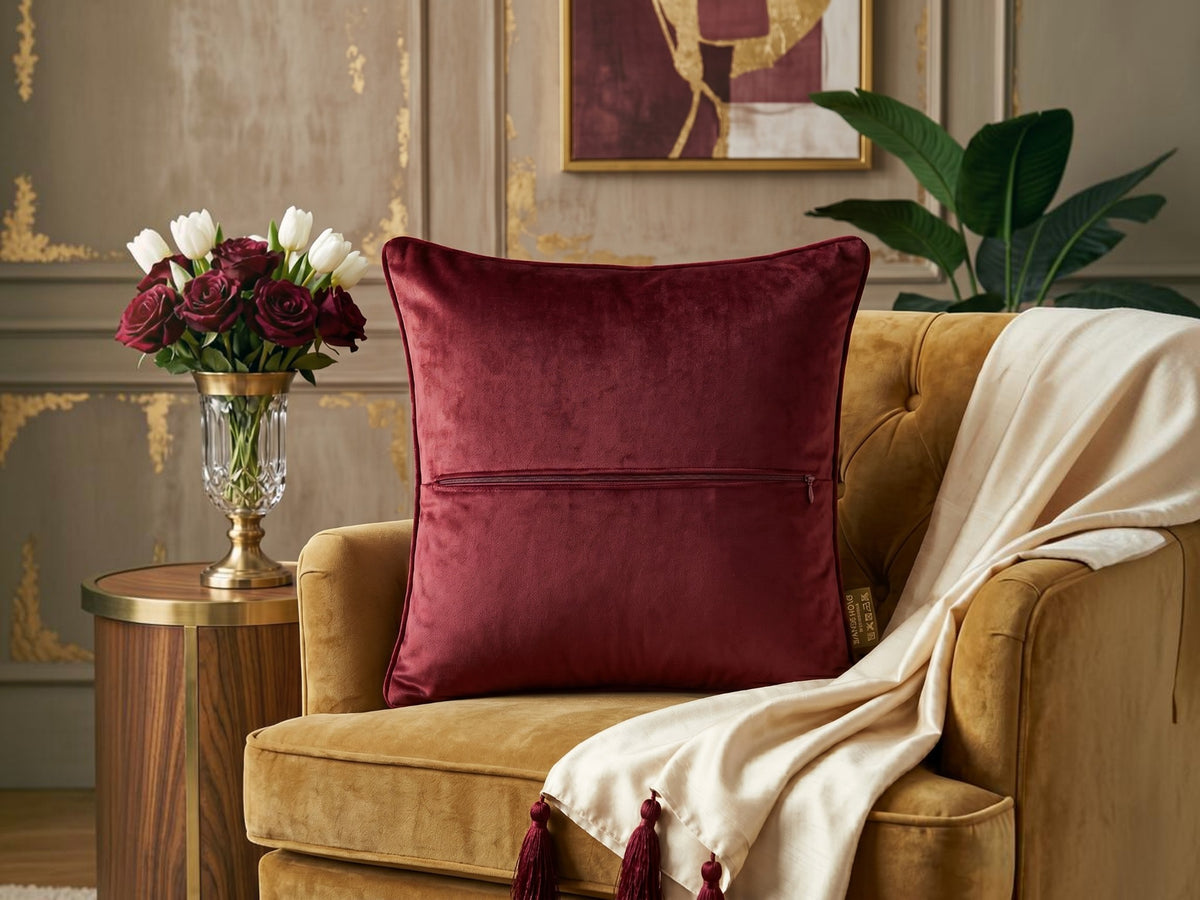 Jagdish Store maroon velvet cushion cover with intricate beaded mandala embroidery and decorative crystal accents.