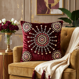 Jagdish Store maroon velvet cushion cover with intricate beaded mandala embroidery and decorative crystal accents.
