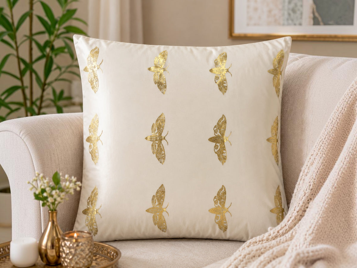 Jagdish Store off-white cushion cover with metallic gold Butterflies print and delicate embellishments.