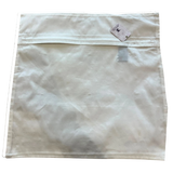 Back view of a plain off-white Jagdish Store decorative throw pillow cover with a hidden zipper closure.