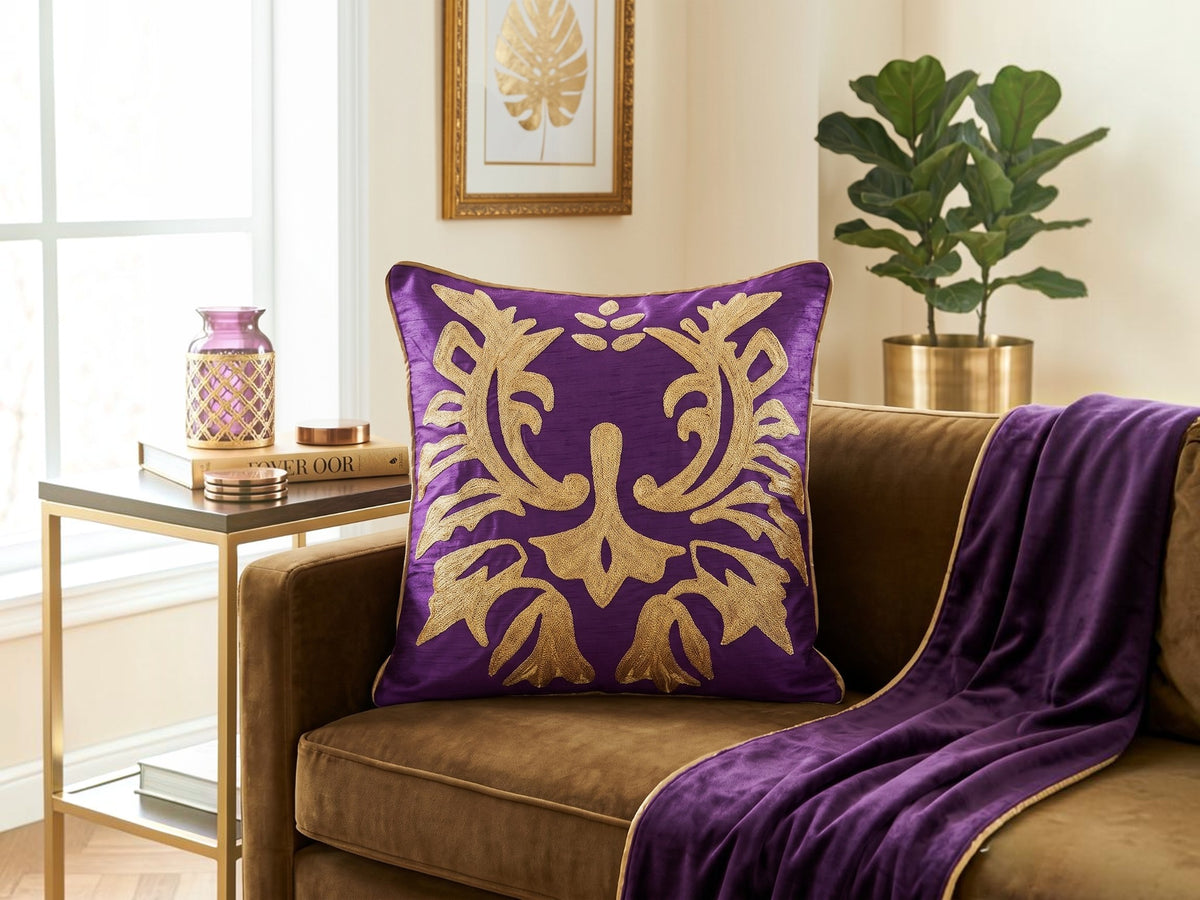 Jagdish Store purple cushion cover with intricate gold sequin floral embroidery and a luxurious textured finish.