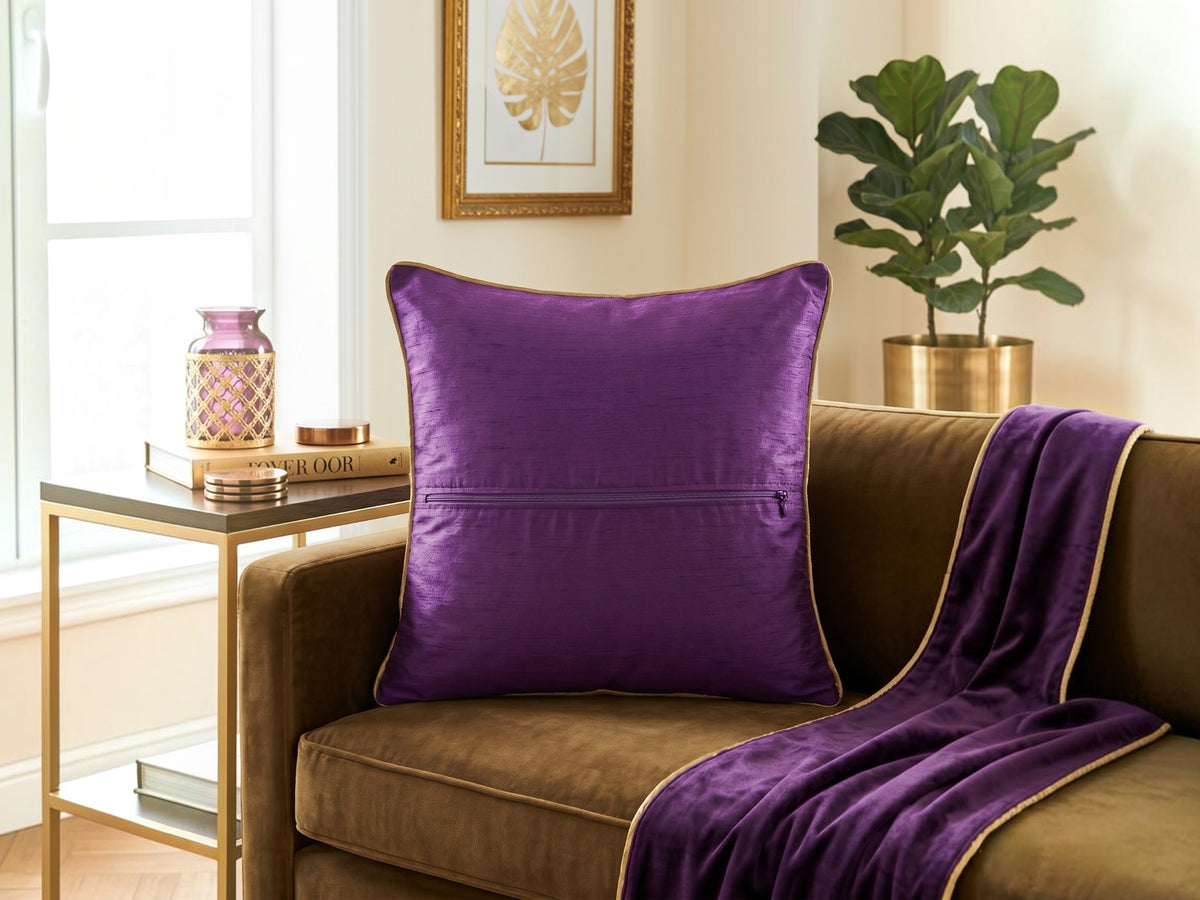Jagdish Store purple cushion cover with intricate gold sequin floral embroidery and a luxurious textured finish.