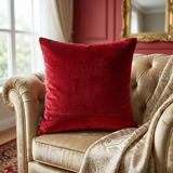 Jagdish Store red velvet cushion cover featuring a hand-embellished crown motif with faux pearls and gold accents.