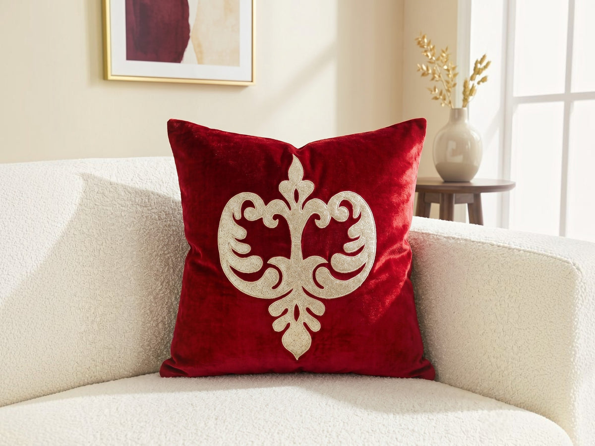 Jagdish Store red velvet cushion cover with an intricate gold glitter filigree motif for festive home decor.