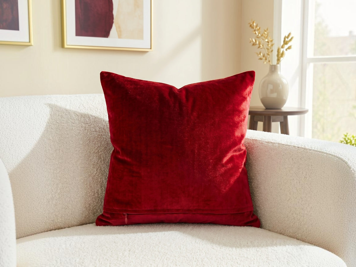 Jagdish Store red velvet cushion cover with an intricate gold glitter filigree motif for festive home decor.