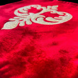 Jagdish Store red velvet throw pillow cover with an intricate gold glitter filigree motif for festive home decor.