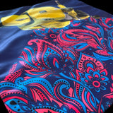 Jagdish Store reversible throw pillow cover with yellow scooter and pink and blue paisley print on navy fabric.