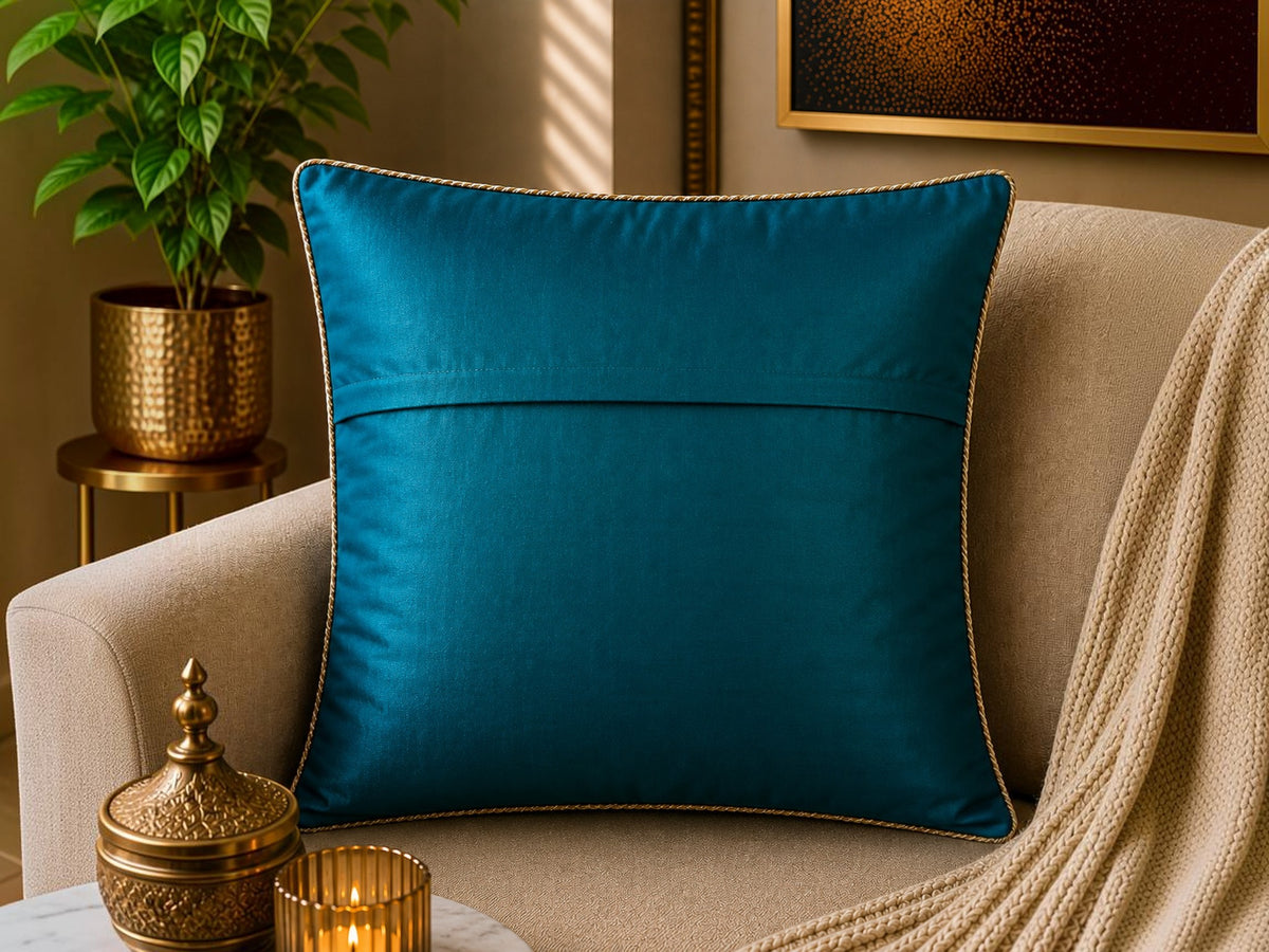 Jagdish Store teal decorative cushion cover with gold sequins and clear bead embellishments in a geometric pattern.