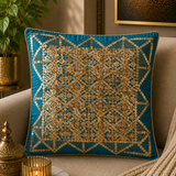 Jagdish Store teal decorative cushion cover with gold sequins and clear bead embellishments in a geometric pattern.